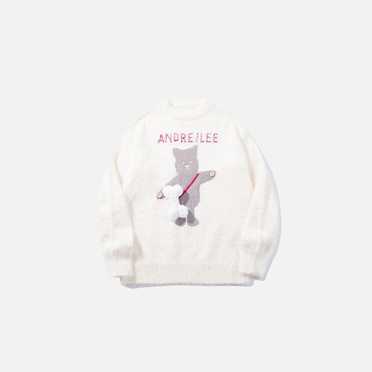 Front view of the apricot Graphic Bear Embroidered Sweater in a gray background
