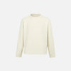 Front view of the apricot Classic Crew Neck Sweater in a gray background